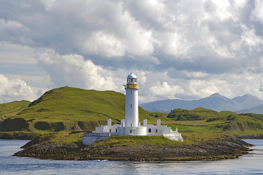 White lighthouse on a barren, green island, high mountains, Stevenson family, Lismore Lighthouse, Oban, Scotland, Great Britain