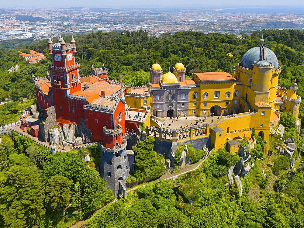 Colourful palace with yellow and red buildings, dome and towers, surrounded by wooded hills, aerial view, Palácio Nacional da Pena, National Palace Pena, Sintra, Lisbon, World Heritage Site, UNESCO, Portugal, Europe