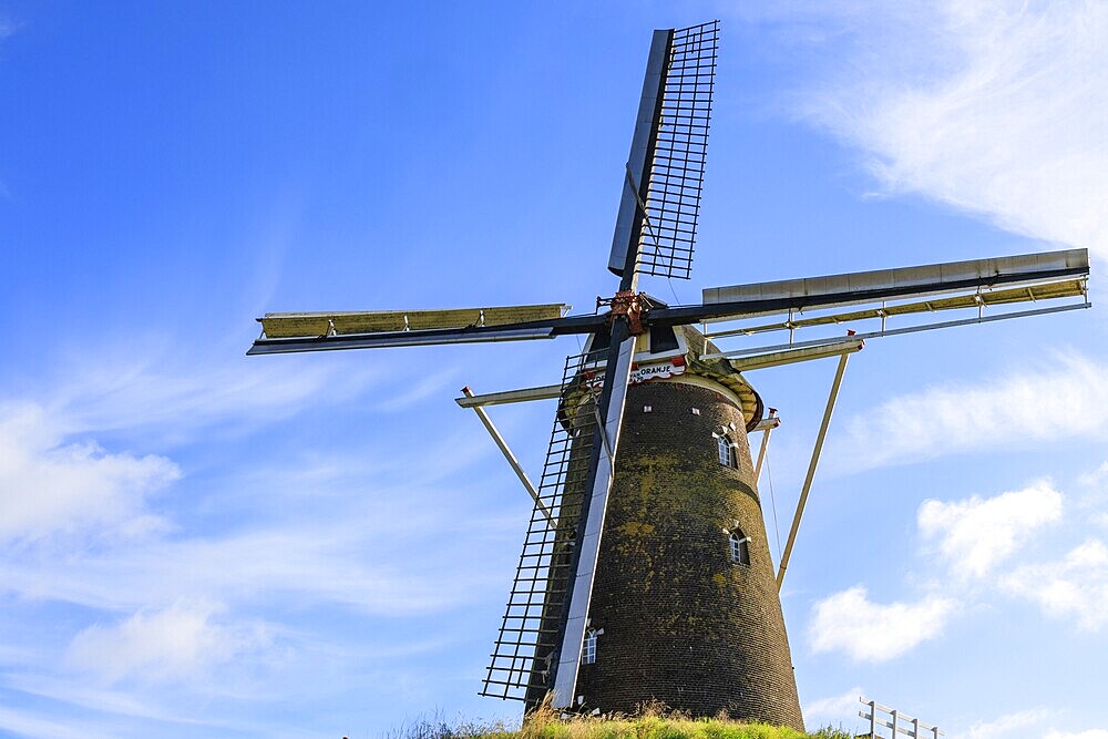 Historic windmill in front of a blue sky with cloudy accents, bredevoort, gelderland, the netherlands