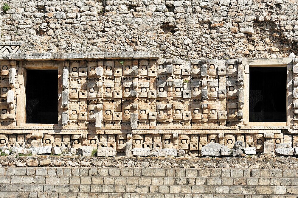 El Palacio, Palace of Kabah, Kabah, Yucatan, Mexico, Central America, detailed view of a stone wall with ancient masks and sculptures, Central America