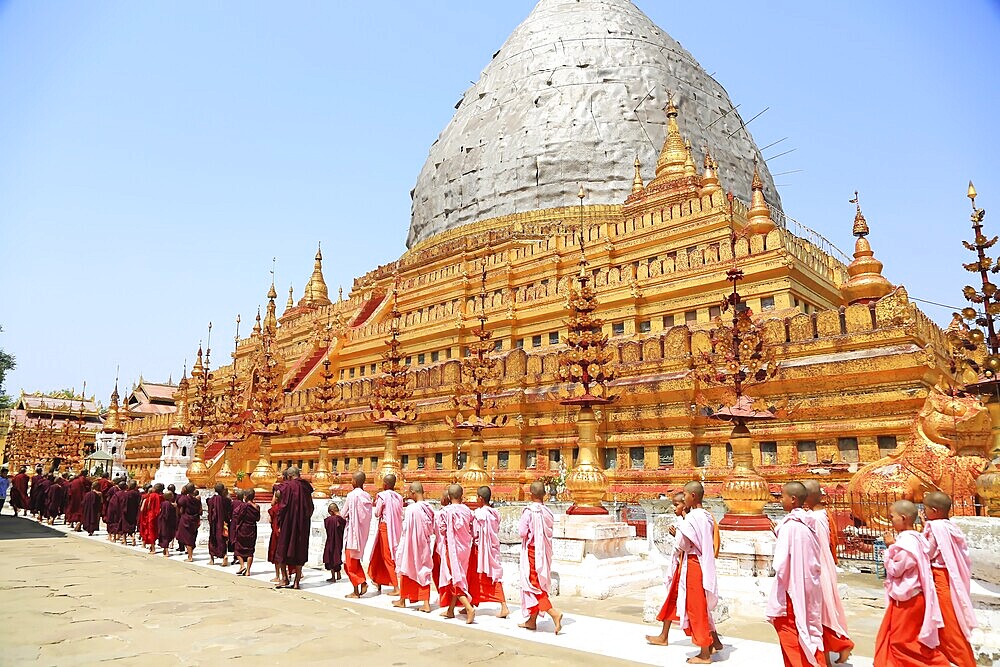 Procession with novices in the Shwezigon Pagoda in Myanmar