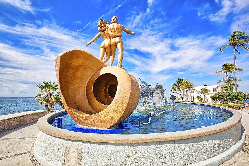 Mazatlan, Mexico-10 December, 2018: Dolphin Statue located on scenic Mazatlan Promenade (Malecon) near the ocean shore and historic city center