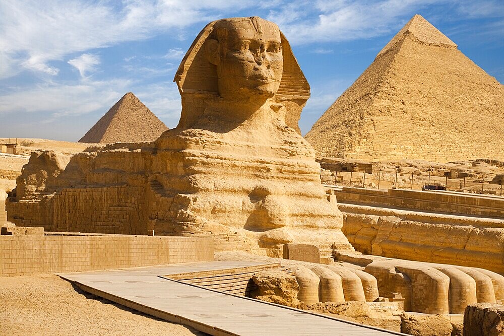 A beautiful profile of the Great Sphinx including the pyramids of Menkaure and Khafre in the background in Giza, Cairo, Egypt, Africa