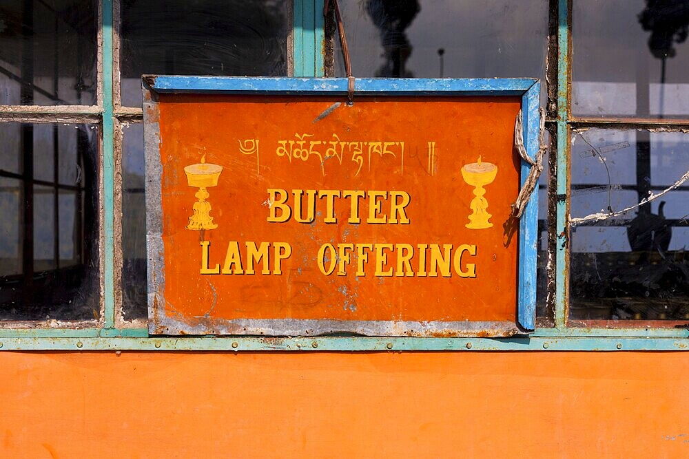 A sign indicates the room containing traditional Buddhist butter lamps at the Rumtek Monastery in Gangtok, Sikkim, India, Asia