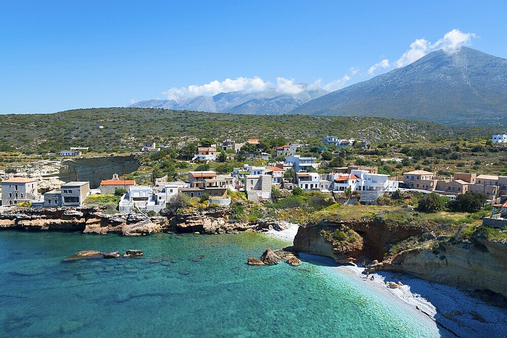 A village on a picturesque bay with mountains in the background and blue sea, Mezapos, Mani, Peloponnese, Greece, Europe