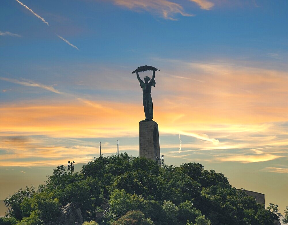 Liberty statue in Budapest on Gellert Hill at sunset