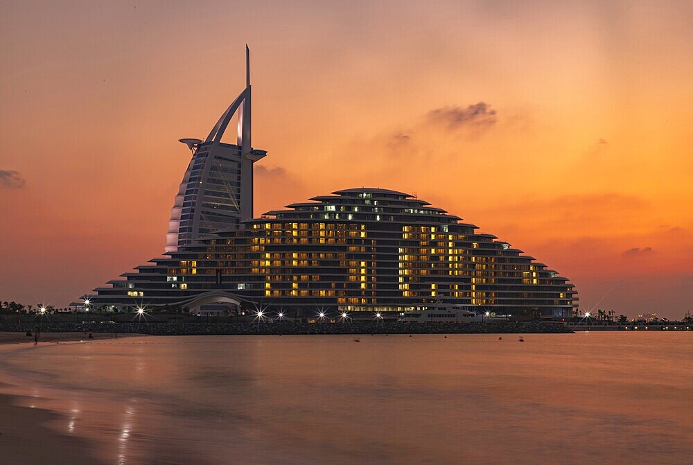 A picture of the Jumeirah Public Beach, the Jumeirah Marsa Al Arab Hotel and the Burj Al Arab Hotel, at sunset