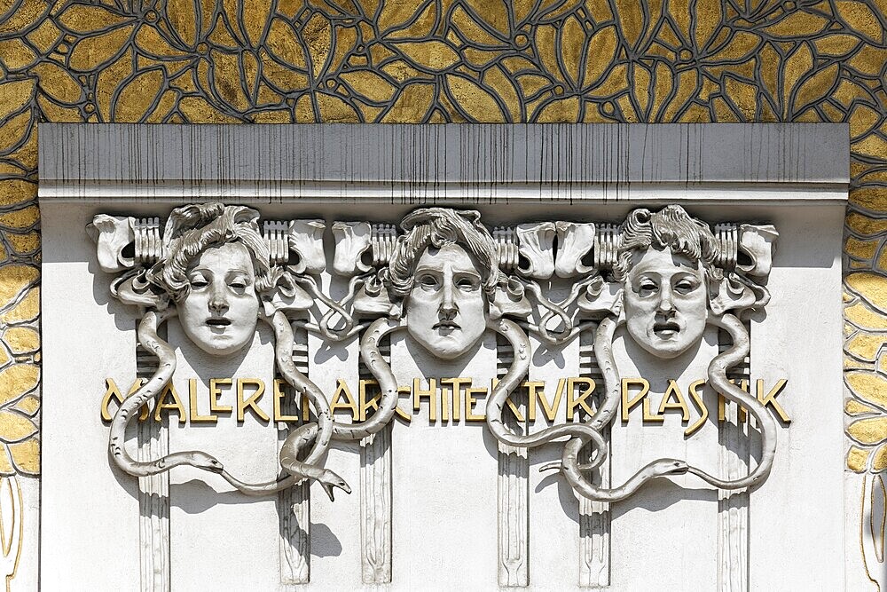 Three women's faces on the Secession building for Contemporary Art, Architecture, Painting, Sculpture, art nouveau decoration, Vienna, Austria, Europe