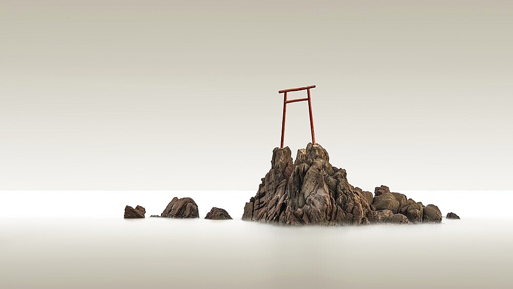 Minimalist long exposure of an old, simple wooden torii on the Pacific coast of Japan