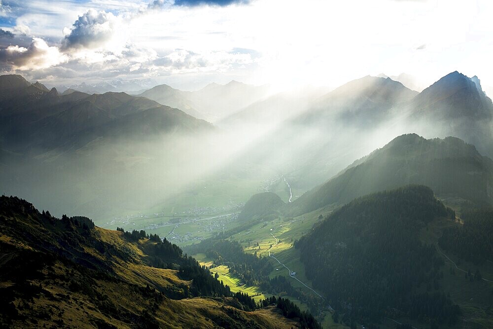 Landscape with sunbeams on the Diedamskopf with view towards Kanisfluh and Damuls, Bregenz Forest, Austria, Europe