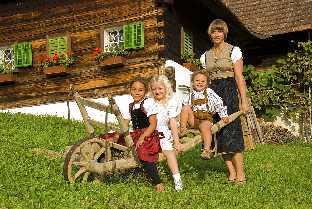 Farmwoman with children on a farm
