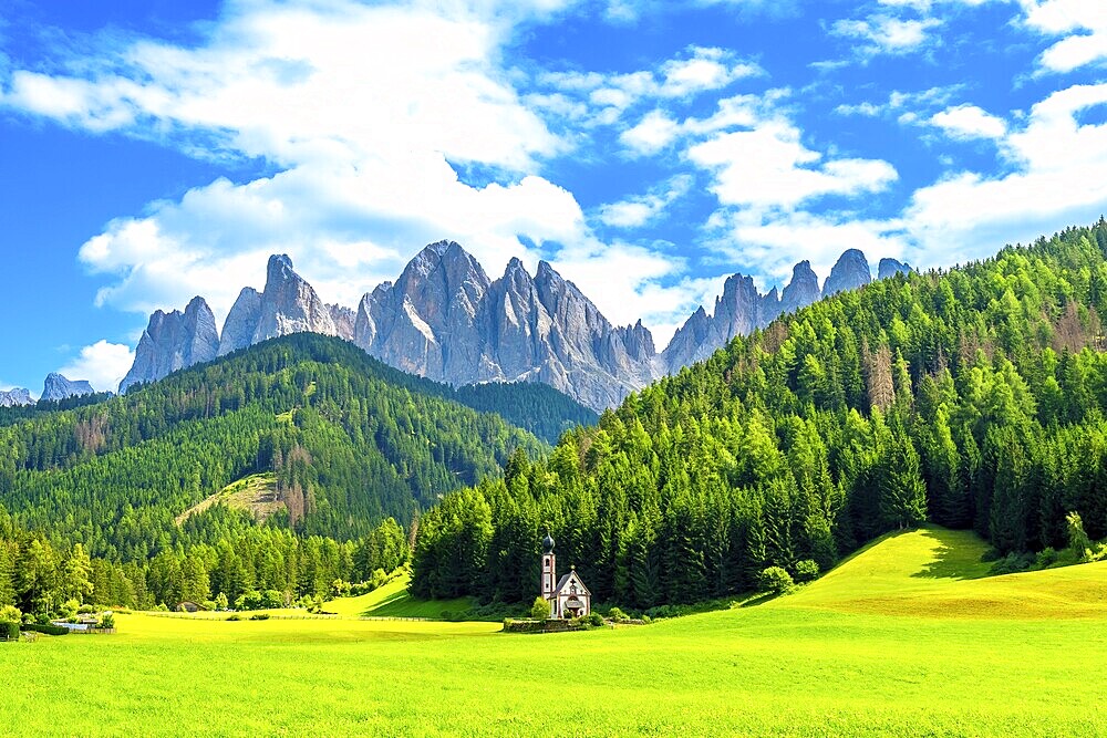 Scenic summer view of the idyllic alpine valley of val di funes with st. Magdalena church and the odle mountain range in the italian dolomites