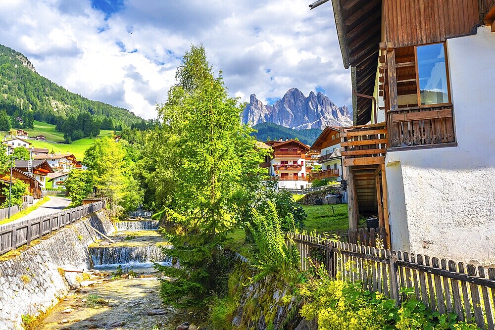 Scenic summer view of santa maddalena village with the odle mountains reflecting in the funes valley, dolomites, italy