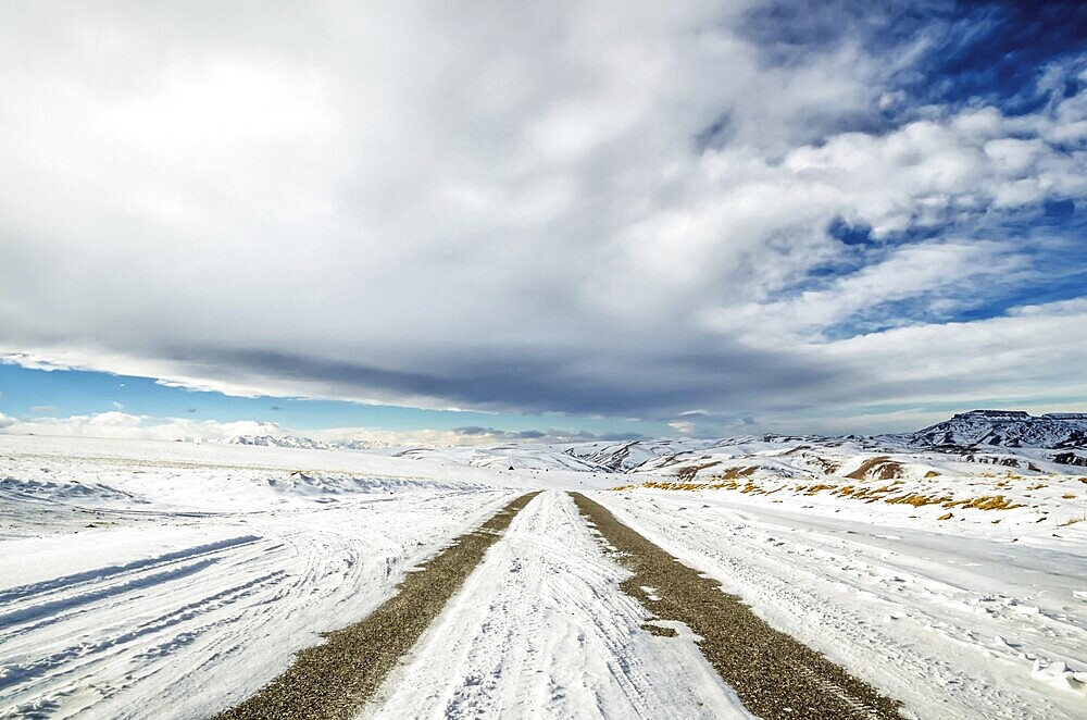 Winter snow-covered road in the Caucasus mountains a wide angle