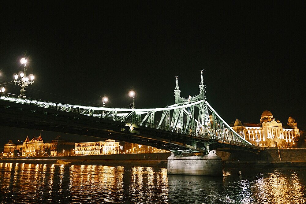 Night illumination of the Freedom Bridge in Budapest.