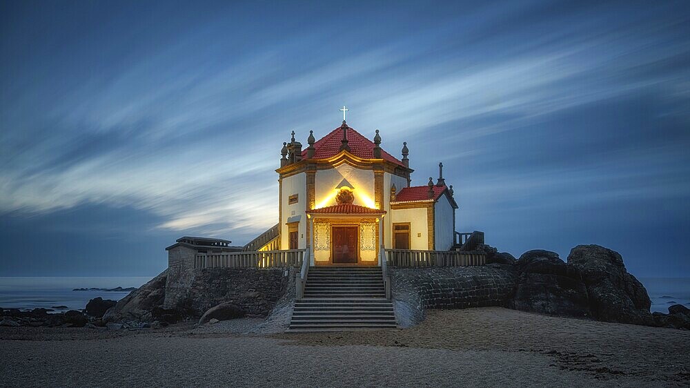 Capela do Senhor da Pedra chapel on the coast of the sea