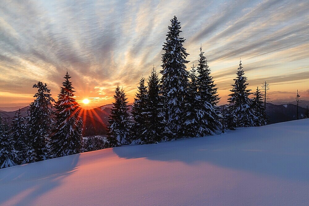 Sunset on the snow plain in the Smrekovica mountains in Velka Fatra