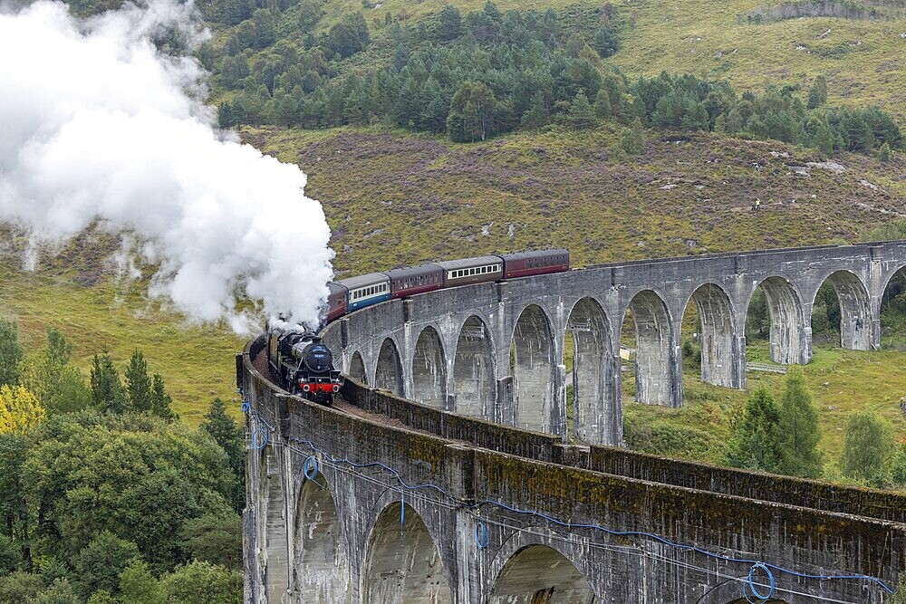 The Jacobite Steam Train, steam railway on the Glenfinnan railway viaduct, known from Harry Potter, Glenfinnan, Highlands, Scotland, Great Britain