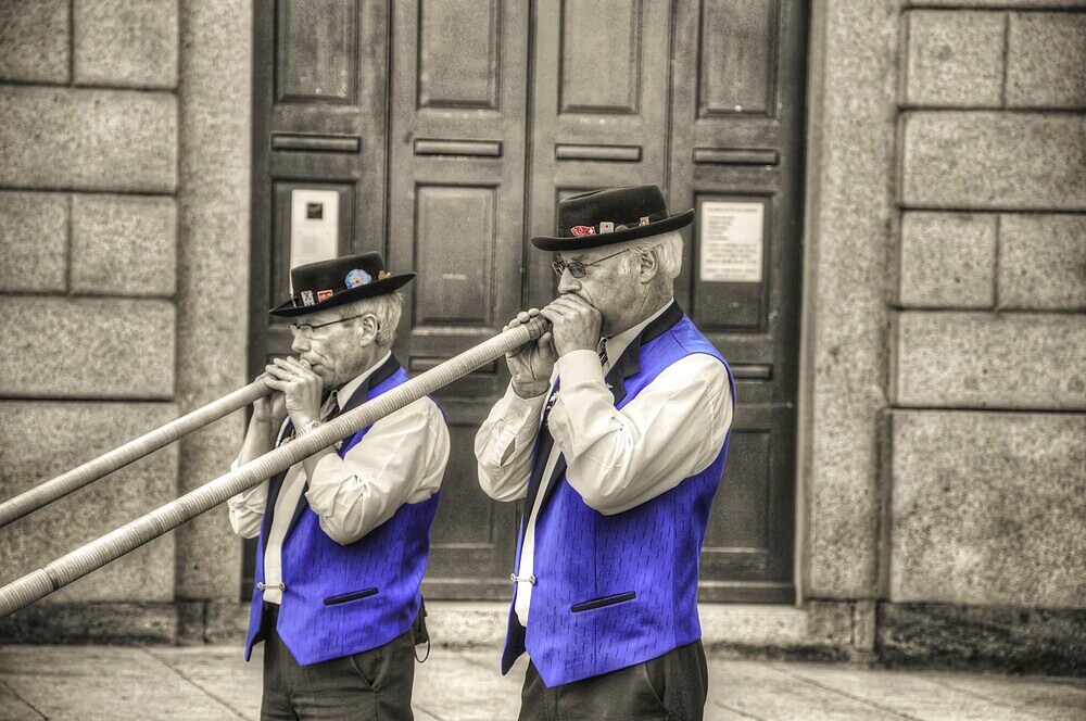 Two Men with Playing Music with Alp Horn in Lugano, Ticino, Switzerland, Europe