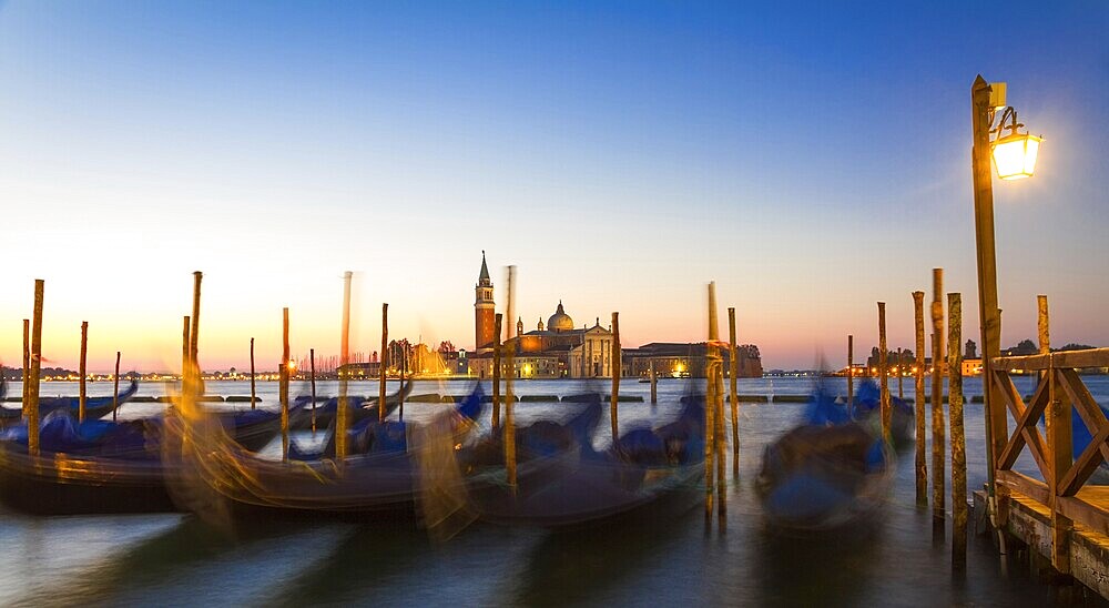 Gondolas at sunrise with San Giorgio di Maggiore church, Venice, Venezia, Italy
