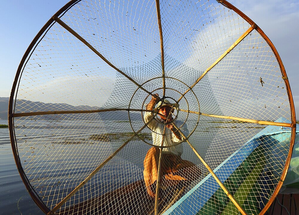 Myanmar travel attraction landmark, Traditional Burmese fisherman with fishing net at Inle lake in Myanmar