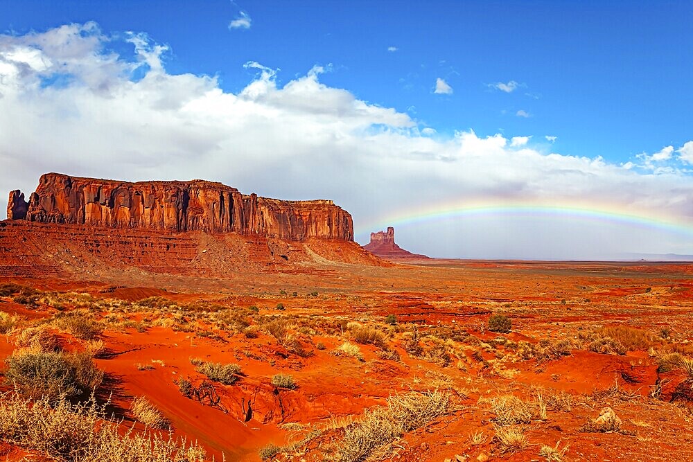 Navajo Indian Reservations. USA. Monument Valley Sentinel Mesa and the bright rainbow. Monument Valley is a unique geological formation in Arizona and Utah