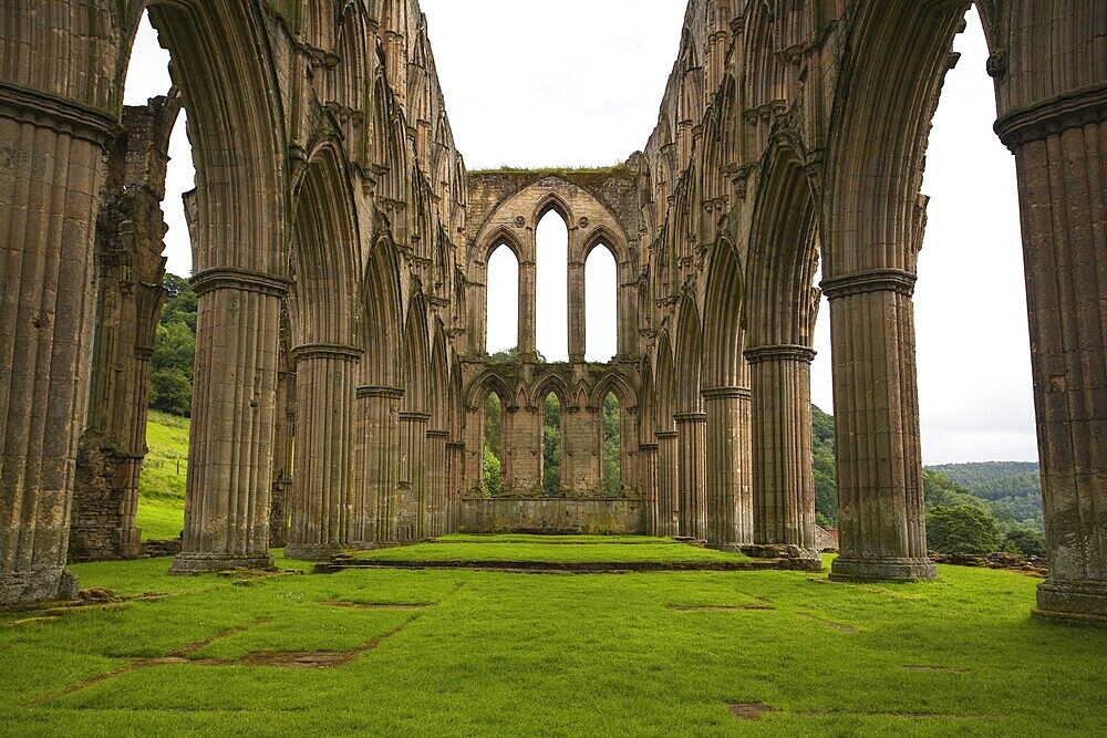 Scenic view of ruins of Rievaulx Abbey under cloudscape, North Yorkshire Moors, National Park, England, United Kingdom