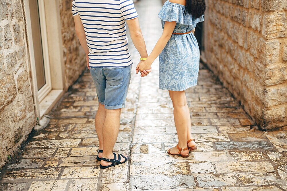 Bride and groom holding hands. Wedding in Montenegro