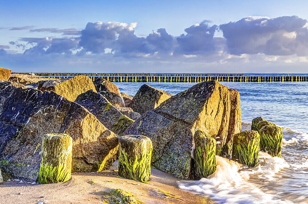 Wooden and rocky groynes on the coastline of the Baltic Sea, Germany