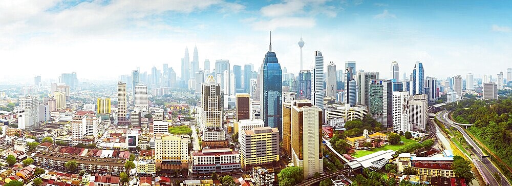 Panorama cityscape view in the middle of Kuala Lumpur city center, early morning with little mist, Malaysia