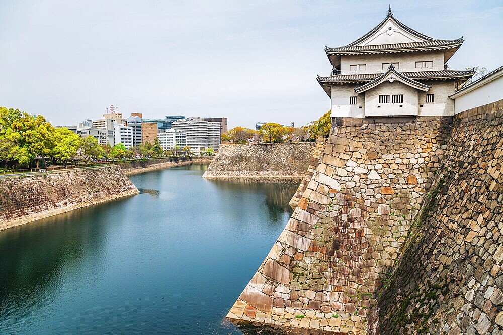 Osaka castle with cherry blossoms of spring in Japan