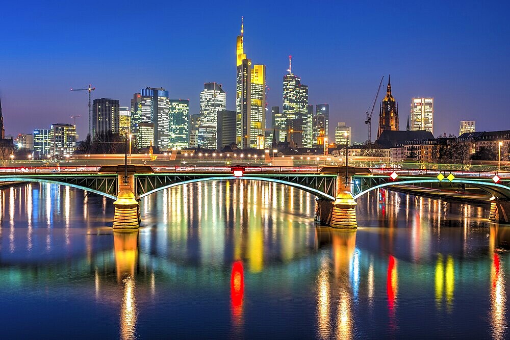 Colourfully illuminated skyscrapers in the city centre of Frankfurt am Main at dusk, Frankfurt am Main, Germany