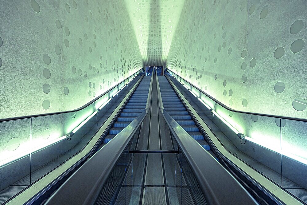 Futuristic-looking escalator in a symmetrical, blue-illuminated tunnel, Elbphilharmonie, concert hall, Hamburg, Free and Hanseatic City of Hamburg, Germany