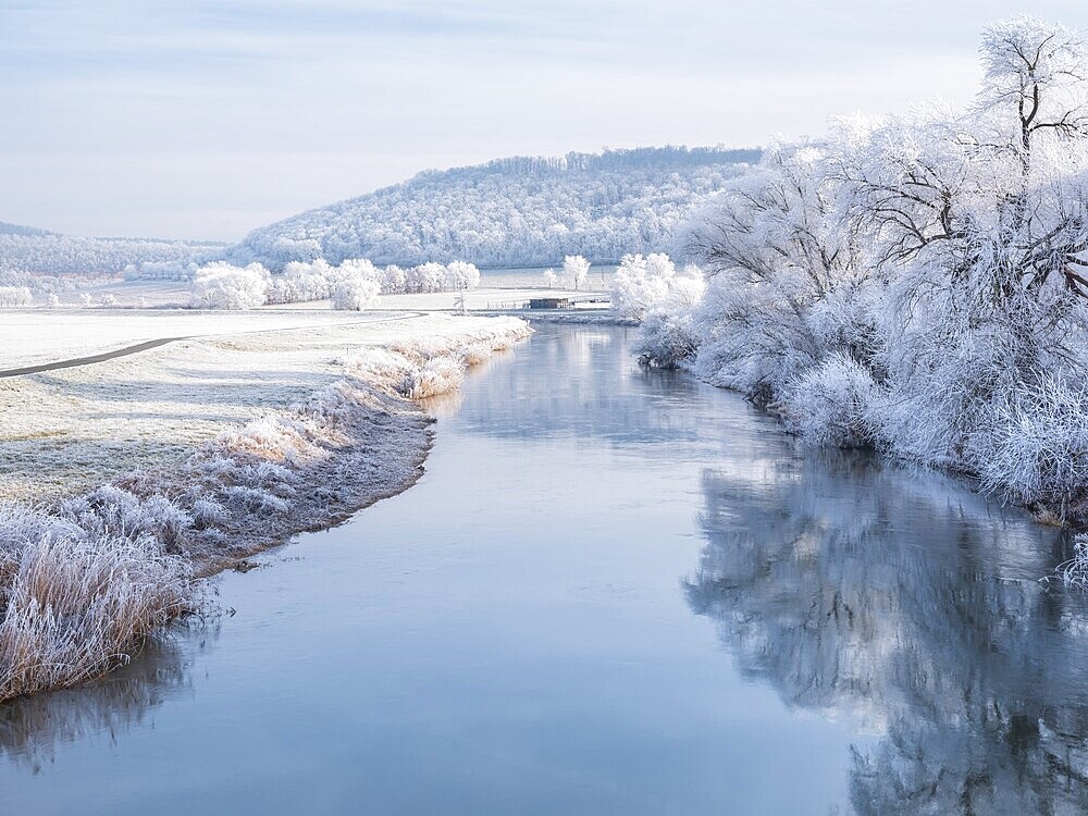 The river Unstrut in the Unstrut valley in winter, fields, trees and forests covered with hoarfrost, Memleben, Saxony-Anhalt, Germany