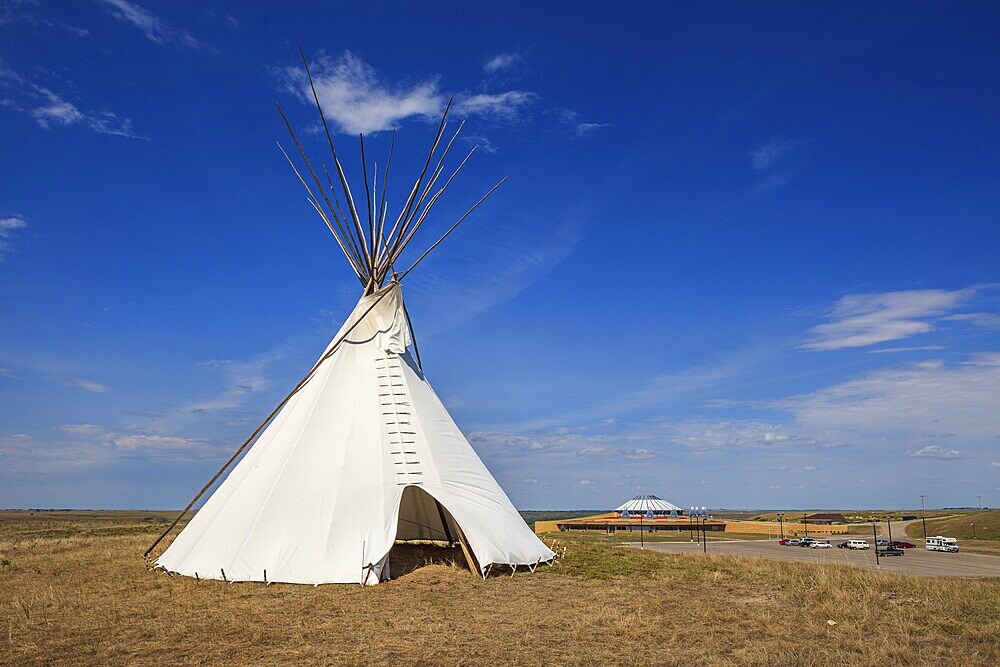 A white canvas tipi set up at the Blackfoot Crossing Historical Park near Cluny, Alberta, Canada
