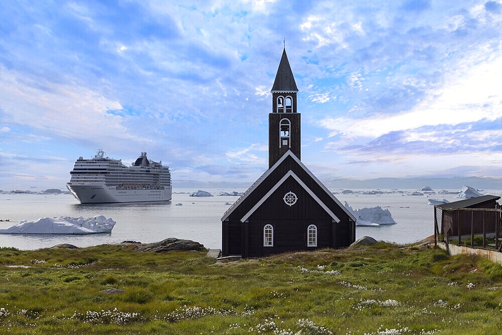 Typical architecture of Greenland Ilulissat with colored houses located near fjords and icebergs