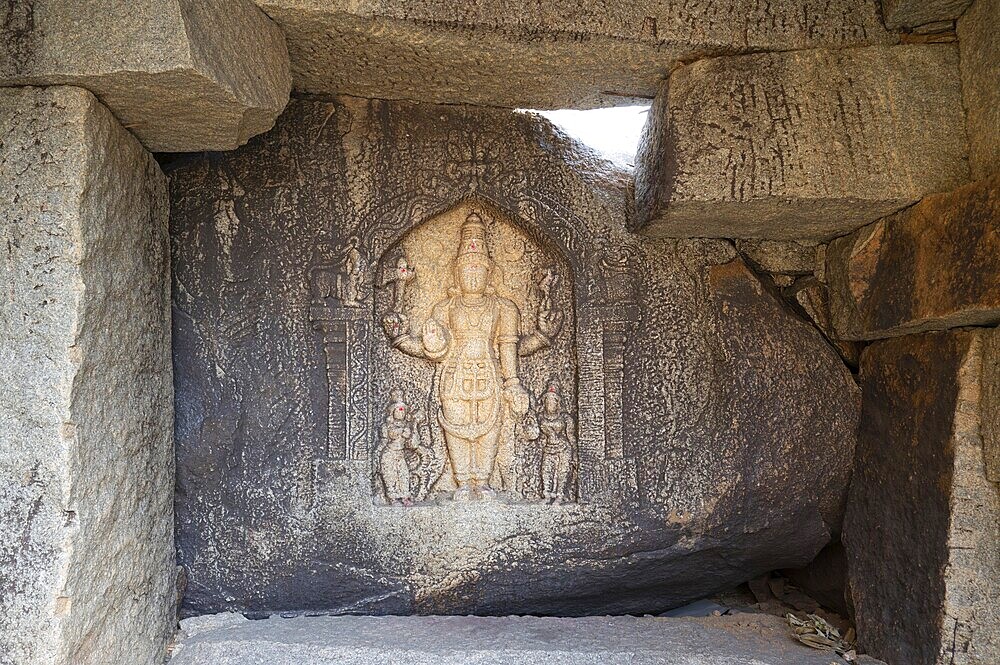 Ancient sculpture at a temple of Hampi, carved into boulder of Tungabhadra river, hindu religion, god, ganesh at ruin of Vijayanagara Empire