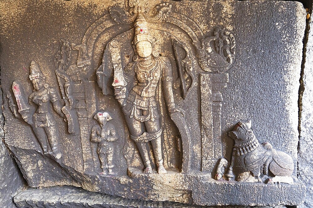 Ancient sculpture at a temple of Hampi, carved into boulder of Tungabhadra river, hindu religion, Lakshmi Narasimha shiva at ruin of Vijayanagara Empire