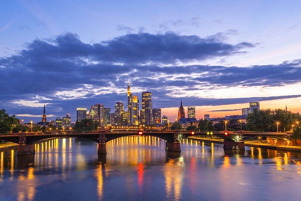 Illuminated Frankfurt City Downtown, Ignatz Bubis Bridge and Main River at Evening Twilight. Hesse, Germany