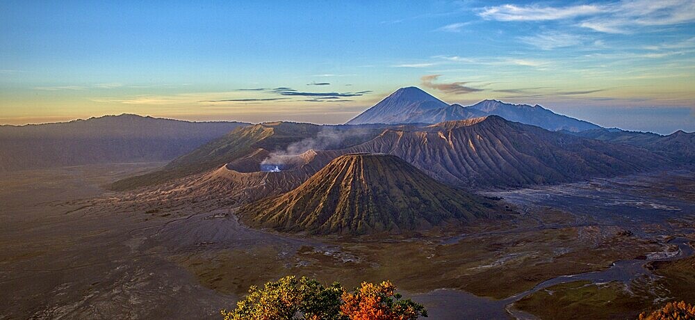 Panorama of Mount Bromo at dusk. The sky is clear and the landscape expansive, Mount Bromo, Bromo Tengger Semeru National Park, Java, Indonesia