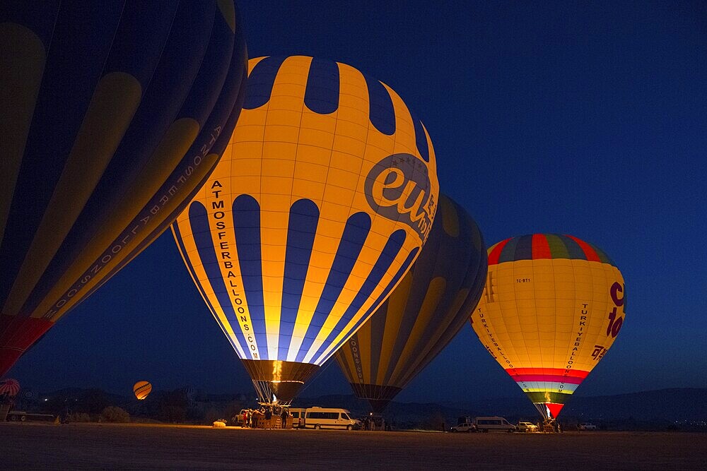 Hot air balloons at night with colourful lighting, creating a fascinating and atmospheric ambience, Göreme National Park, Göreme Tarihî Millî Parkı, Nevsehir Province, Nevşehir, Cappadocia, Cappadocia, Cappadocia, Cappadocia, Central Anatolia, Turkey