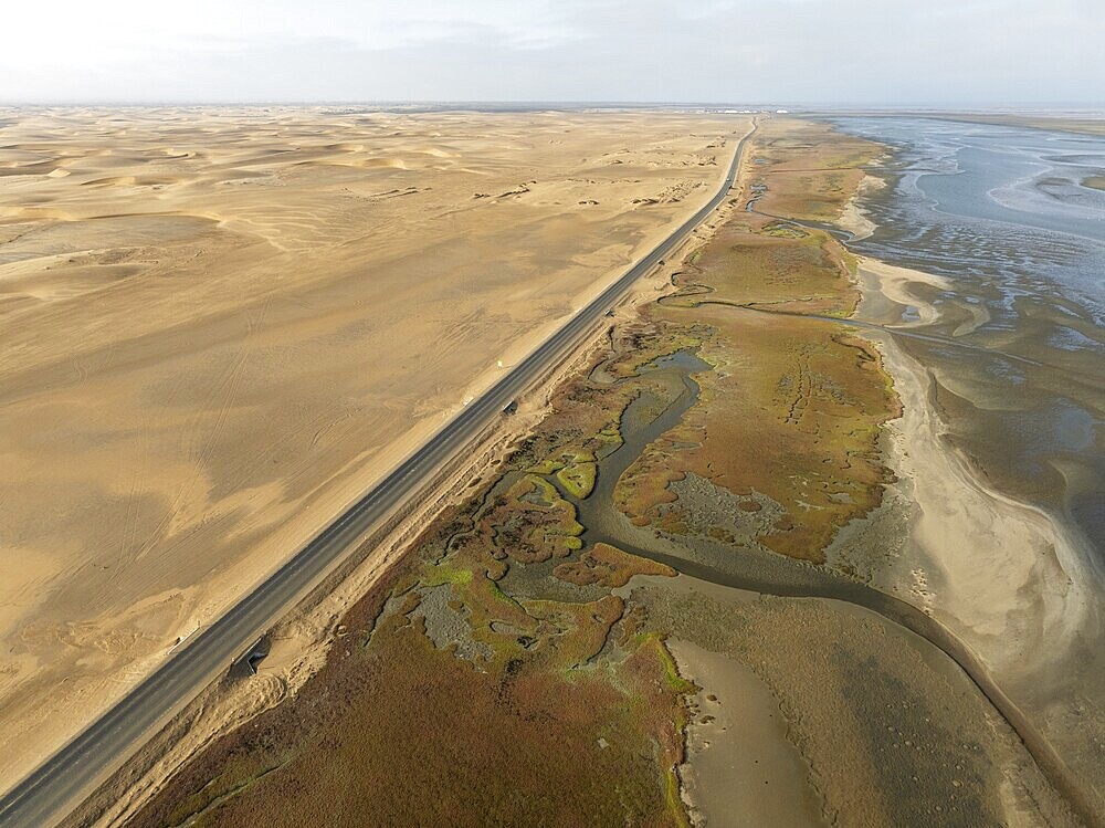 The Walvis Bay Lagoon between Namib Desert and Atlantic Ocean at low tide. Aerial view. Drone shot. Namibia