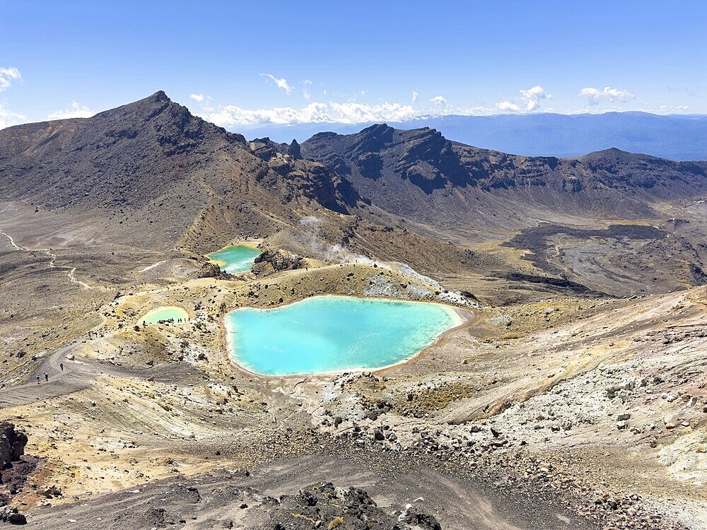 On the hiking trail of the Tongariro Alpine Crossing in Tongariro National Park with a view of the Emerald Lakes, North Island, New Zealand, Oceania
