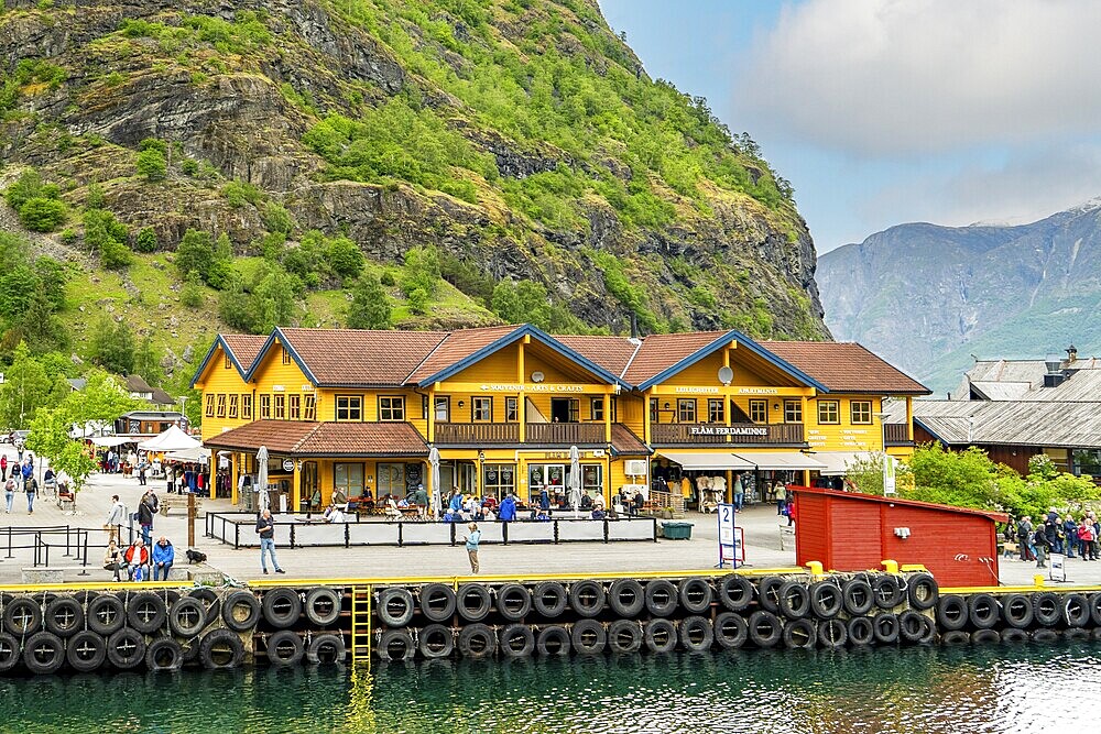 Bustling tourist center at Flam harbor with traditional buildings