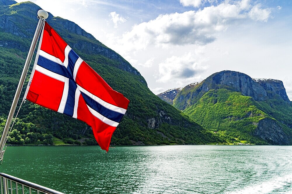 Norwegian flag flying on a ferry in Naeroyfjord
