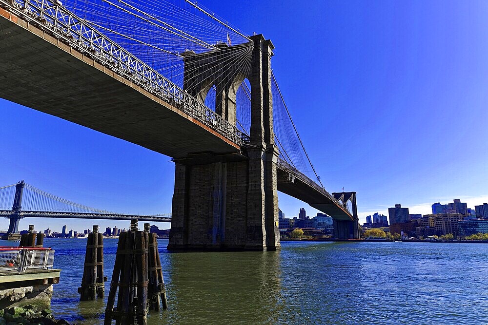 Manhattan, New York, USA, United States of America, North America, The Brooklyn Bridge stretches majestically across the water with the skyline in the background