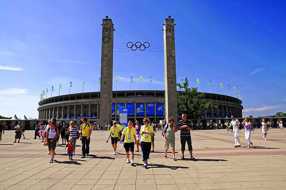 Berlin Olympic Stadium by architect Werner March 1936, reconstruction with roof construction by Gerkan, Marg and Partners 2004, Charlottenburg, Berlin, Tourists in front of the Berlin Olympic Stadium in sunny weather, Berlin, Germany