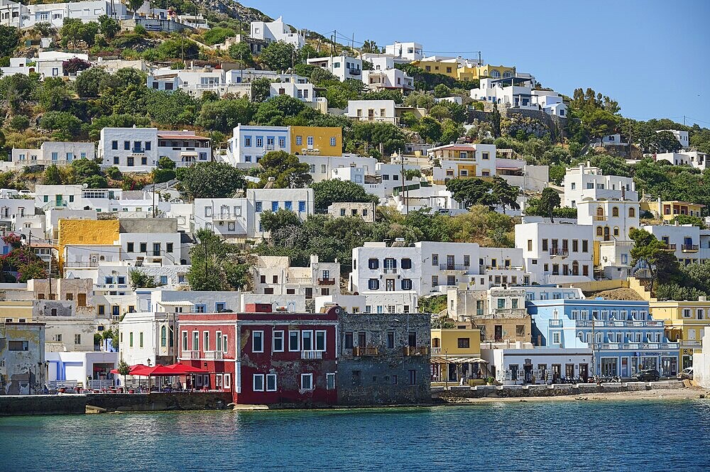 Colourful coastal houses on the hillside, Mediterranean architecture by the sea, Lakki, Leros, Dodecanese, Greek Islands, Greece