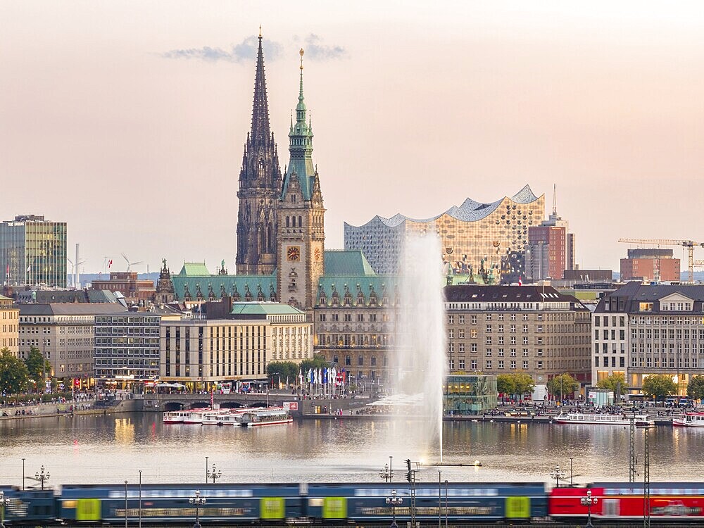 Aerial view of the Inner Alster with Kennedy Bridge, Alster Fountain, Jungfernstieg, City Hall and Elbphilharmonie at sunset, Hamburg, Germany