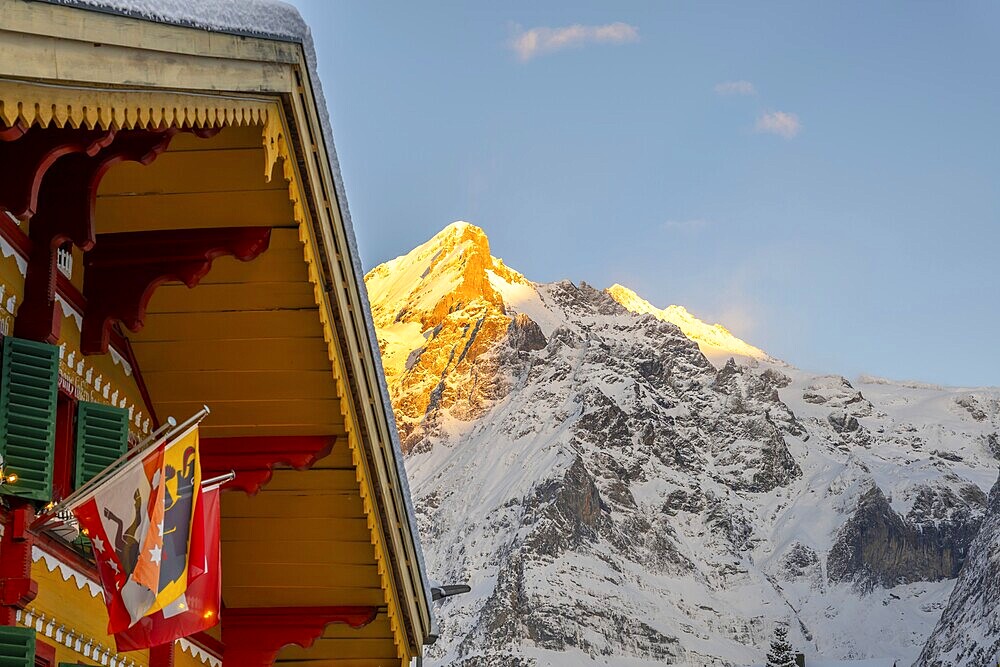 House and Mountain Peak in a Snowy Winter Day in Grindelwald, Bern Canton, Switzerland